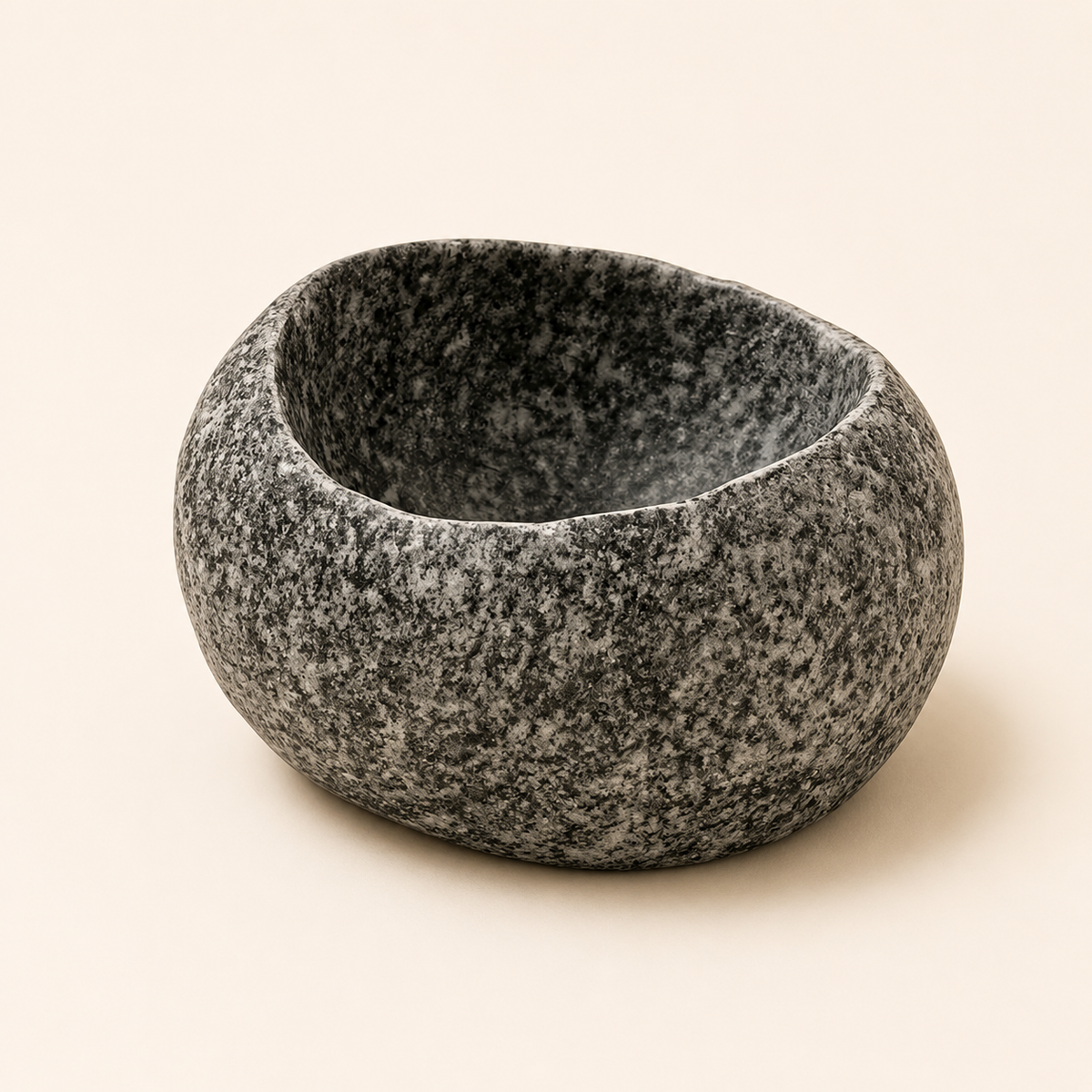 Granite mortar on a beige background