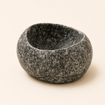 Granite mortar on a beige background
