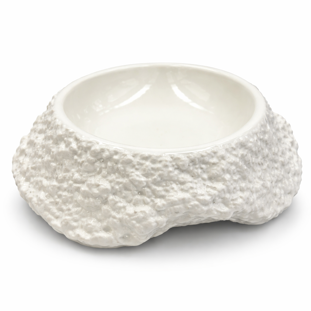 White ceramic bowl with textured surface on a white background