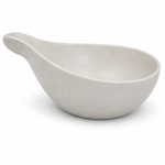 White ceramic spoon rest on a white background