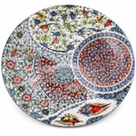 Decorative ceramic plate with intricate floral and geometric patterns on a white background