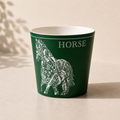 Green mug with horse design and 'HORSE' text on a beige background