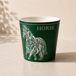 Green mug with horse design and HORSE text on a beige background