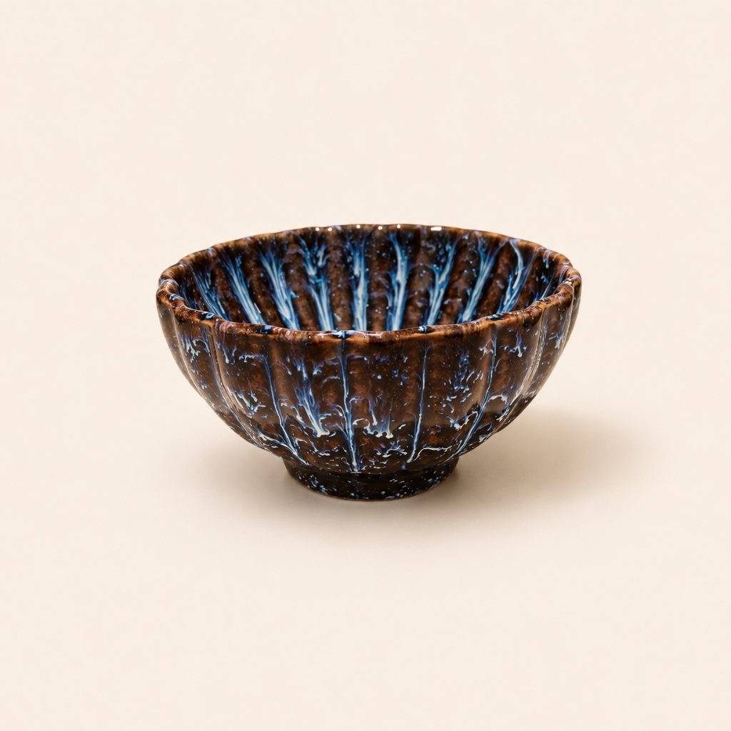 Ceramic bowl with blue interior on a beige background
