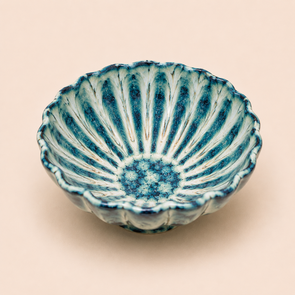 Ceramic bowl with blue and white pattern on a beige background