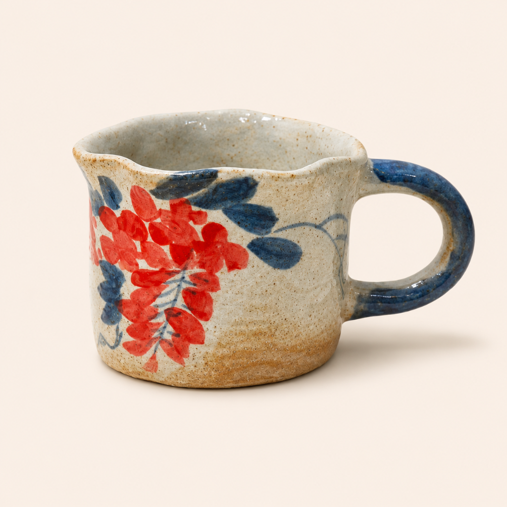 Ceramic mug with floral design on a beige background