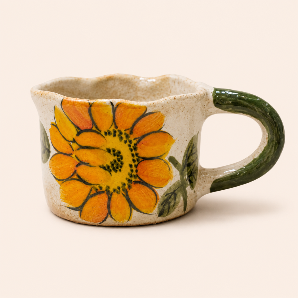 Ceramic mug with a sunflower design on a beige background