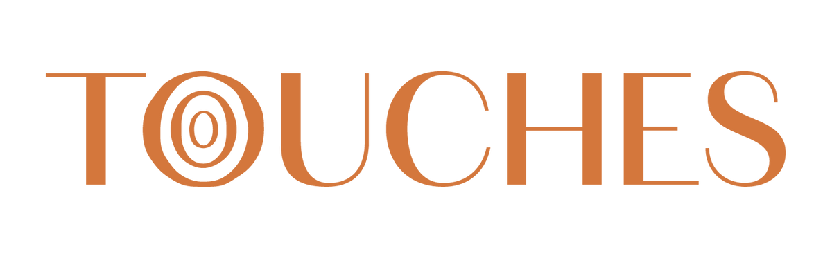 Logo with the word 'TOUCHES' in a stylized font on a white background